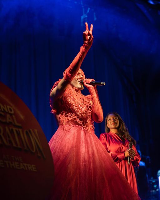 Layton Williams wearing The Red Blooded Woman Dress at The Palace Theatre - June 2021